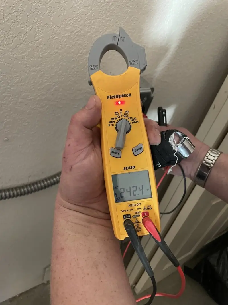 Voltage testing with clamp meter during Ceiling Fan Installation in Yorktown
